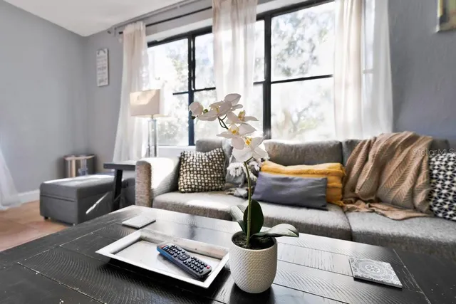 a living room with furniture and a large window