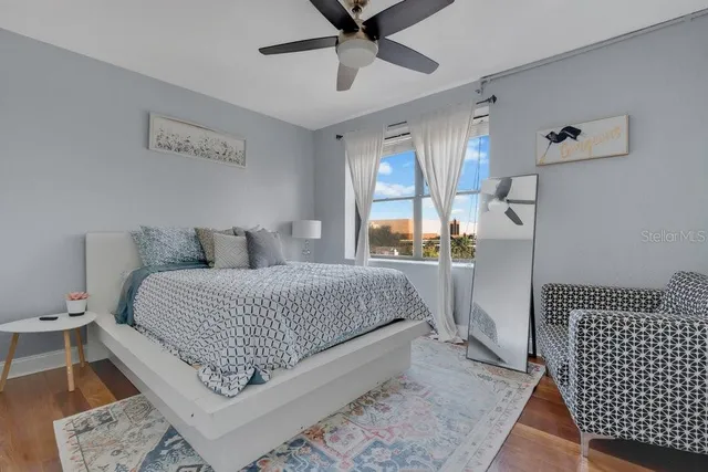 a bedroom with a bed and window