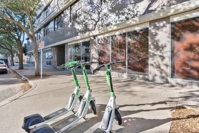 a view of a chair and tables in the patio