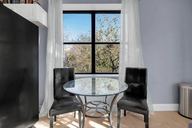 a view of a dining room with furniture window and outside view