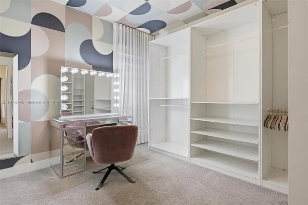 a view of a livingroom with furniture and chandelier