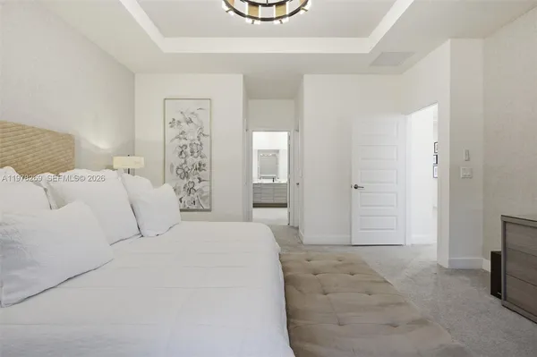 a bedroom with a bed and a couch