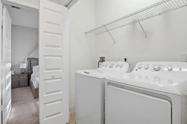 a utility room with dryer and washer