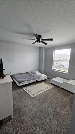a view of a livingroom with furniture and windows