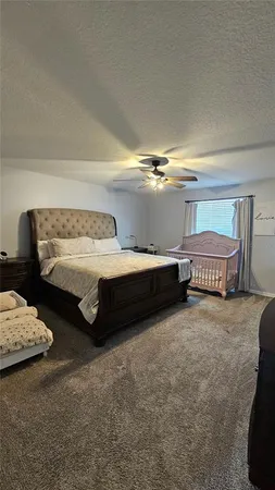 a bedroom with a bed and a cabinets
