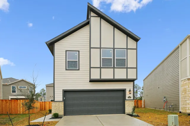 a front view of a house with a garage