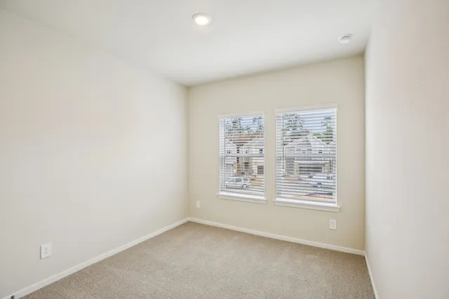 an empty room with windows