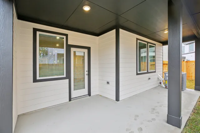 a view of a hallway with windows