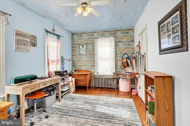 a bedroom with furniture and a window