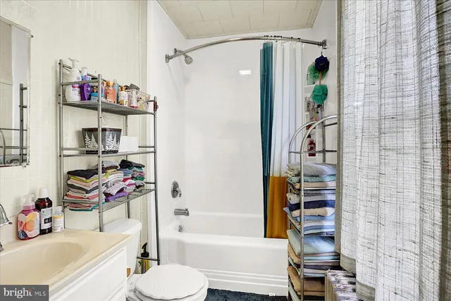 a bathroom with a toilet and shower