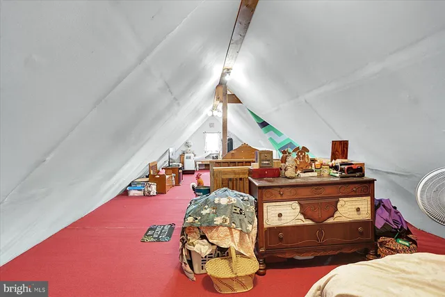 a bed room with furniture and a wooden floor