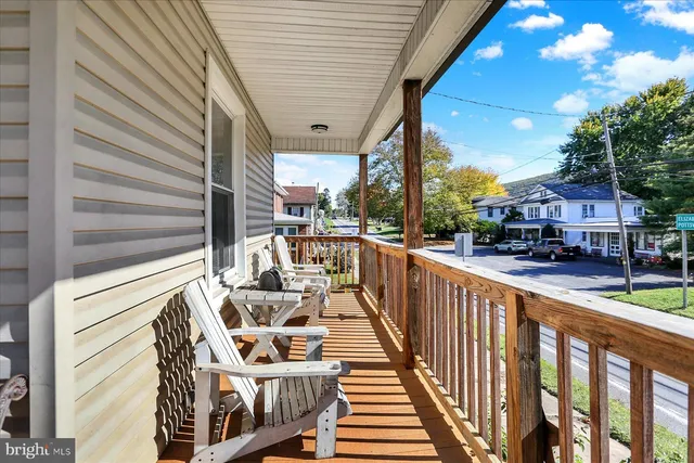 a view of a balcony with chairs