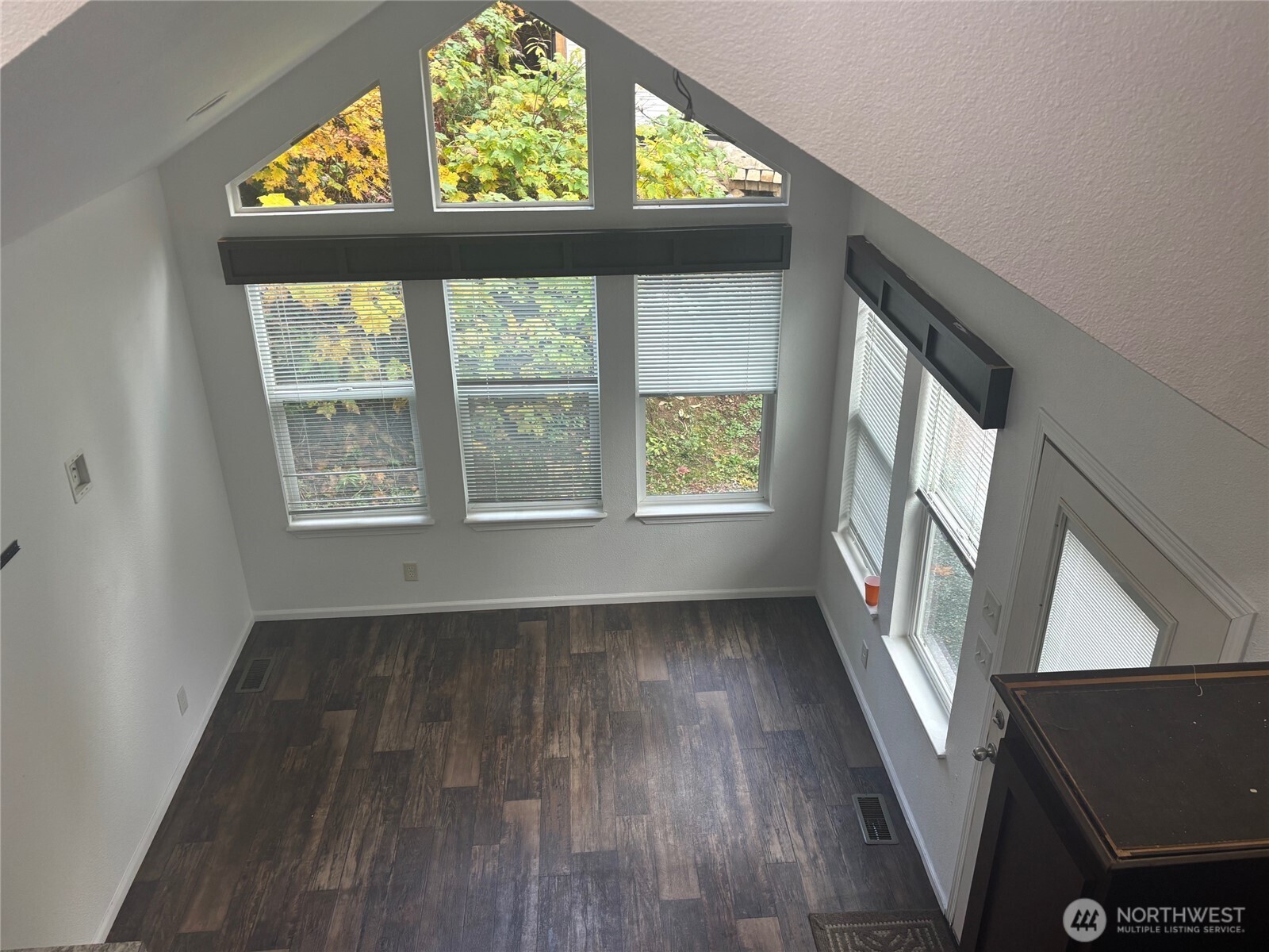 45182 Kimta Loop, Unit 3B84 Concrete, WA 98237 - Photo 11 of 37 an empty room with wooden floor and windows