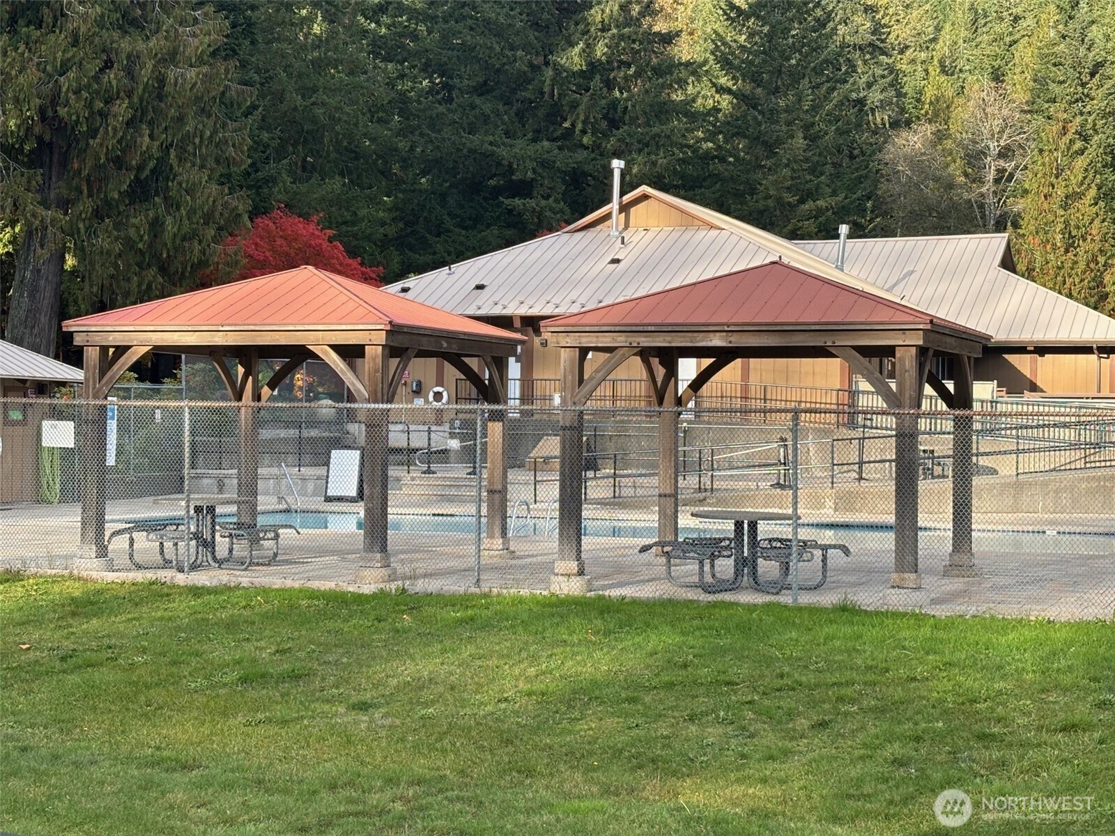 45182 Kimta Loop, Unit 3B84 Concrete, WA 98237 - Photo 35 of 37 a backyard of a house with table and chairs