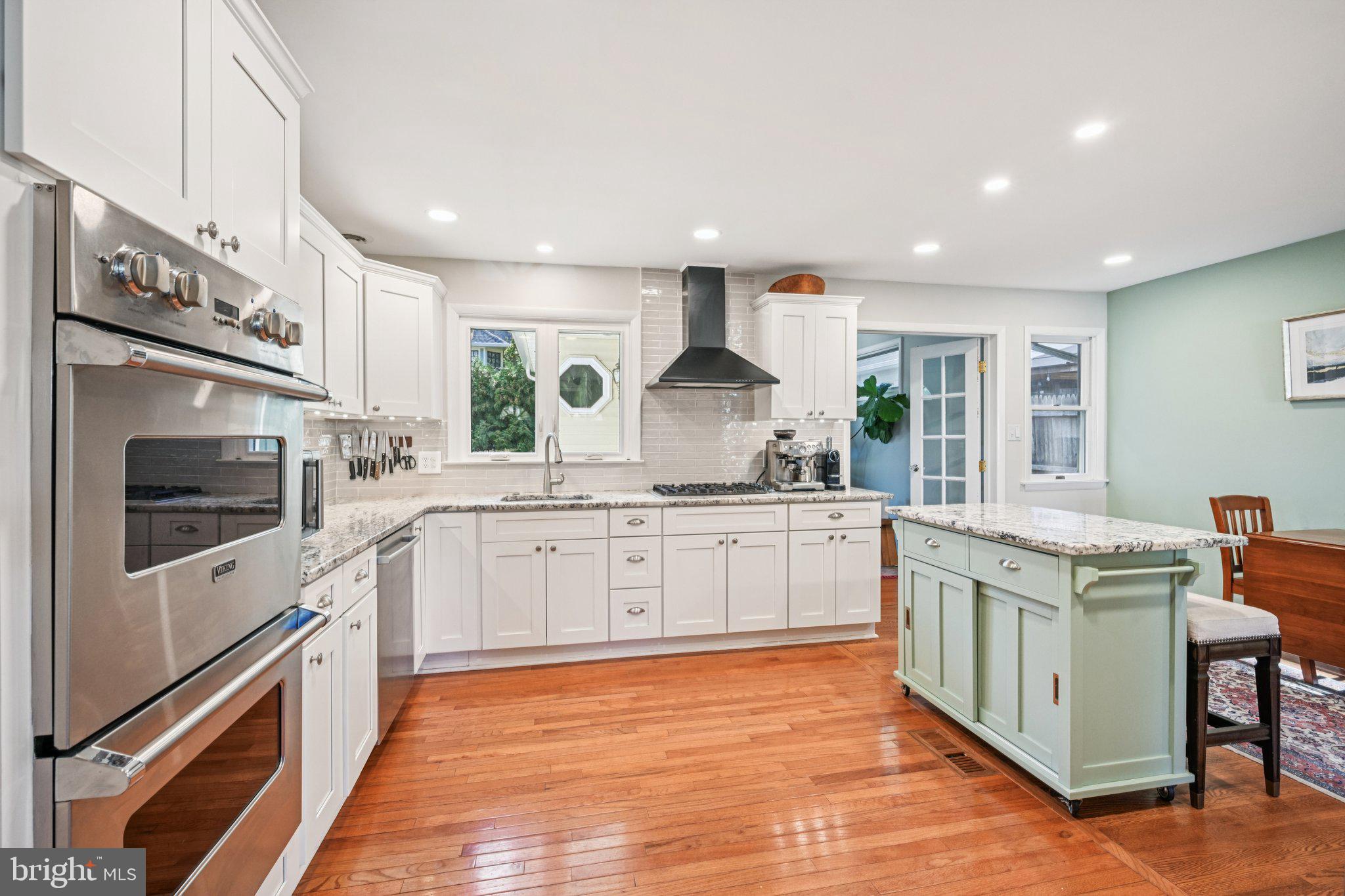412 East Summit Avenue Haddonfield, NJ 08033 - Photo 11 of 35 a kitchen with stainless steel appliances granite countertop a stove and a sink