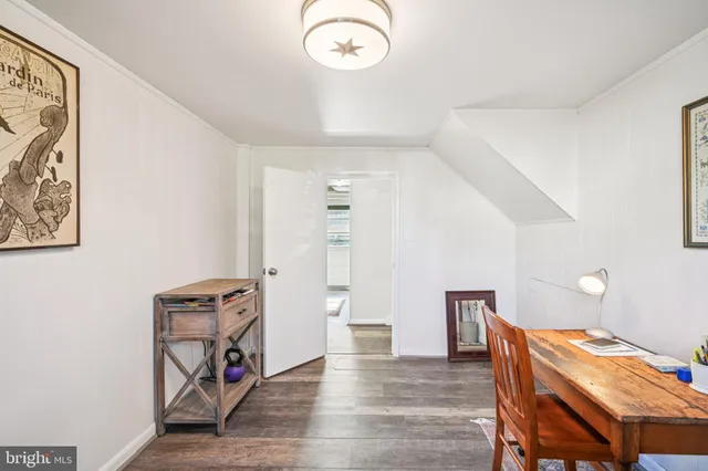 a view of a livingroom with furniture and wooden floor