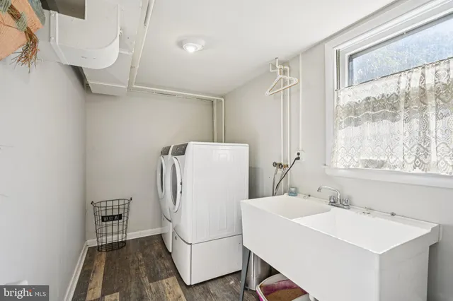 a white bath tub sitting next to a white sink