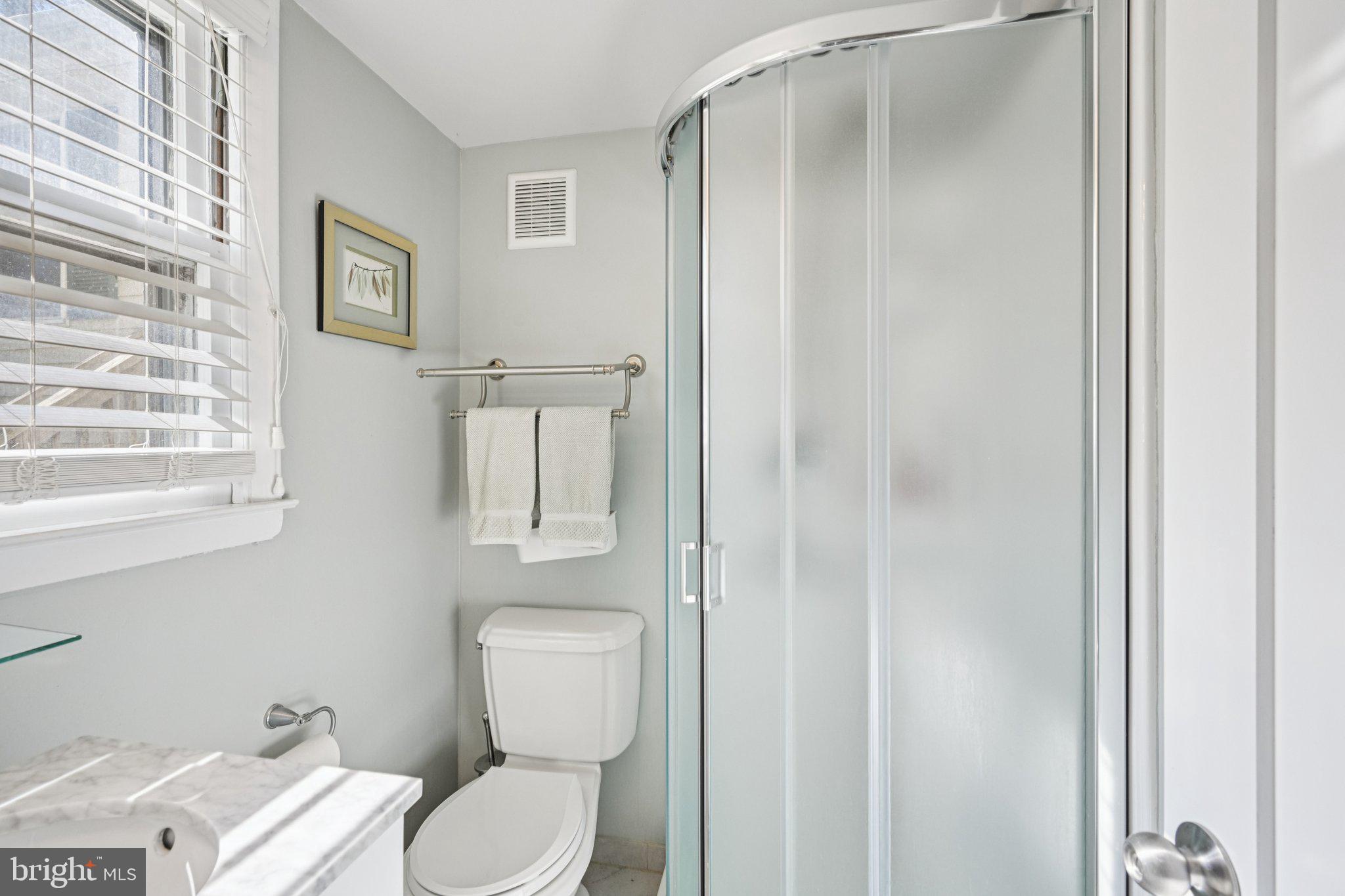 412 East Summit Avenue Haddonfield, NJ 08033 - Photo 19 of 35 a white toilet sitting next to a bathroom sink