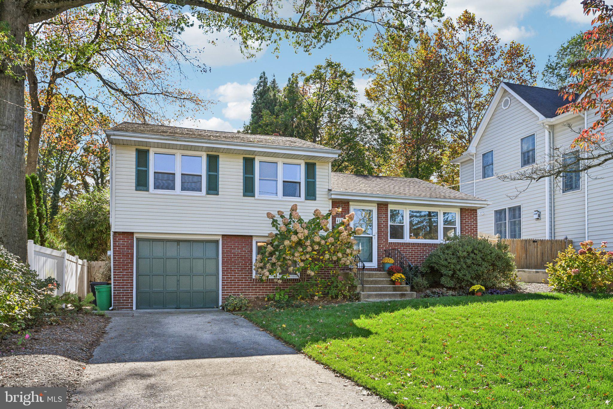 412 East Summit Avenue Haddonfield, NJ 08033 - Photo 2 of 35 a front view of a house with garden
