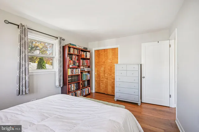 a bedroom with a bed and a closet