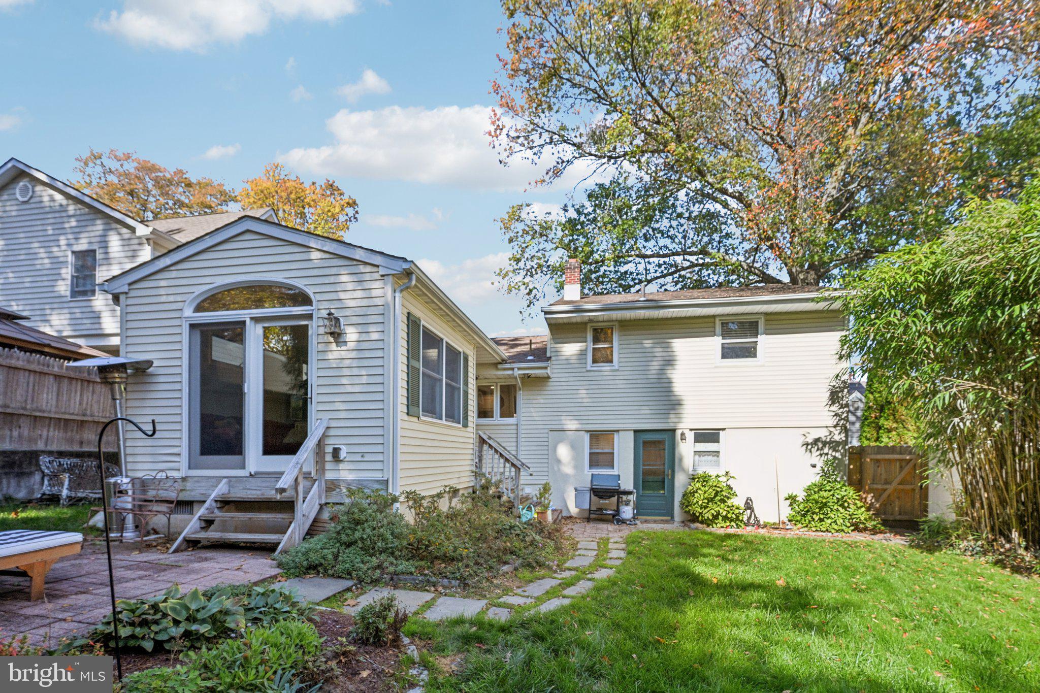 412 East Summit Avenue Haddonfield, NJ 08033 - Photo 33 of 35 a front view of a house with a garden