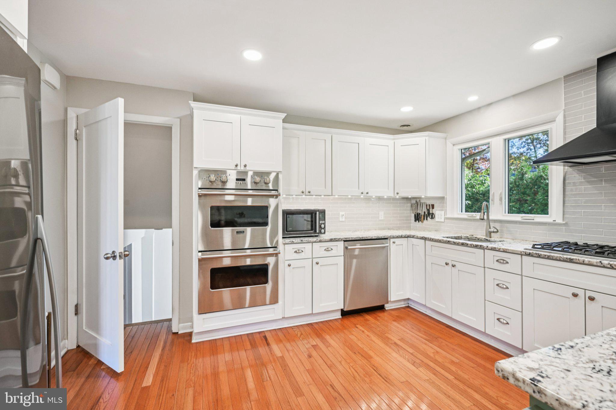412 East Summit Avenue Haddonfield, NJ 08033 - Photo 10 of 35 a kitchen with stainless steel appliances granite countertop a refrigerator and a sink