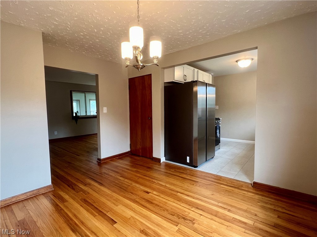 3923 Jaeger Road Lorain, OH 44053 - Photo 21 of 34 Dining room featuring a textured ceiling and light tile floors