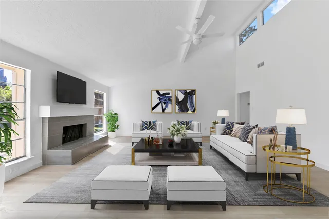 a living room with furniture fireplace and a flat screen tv