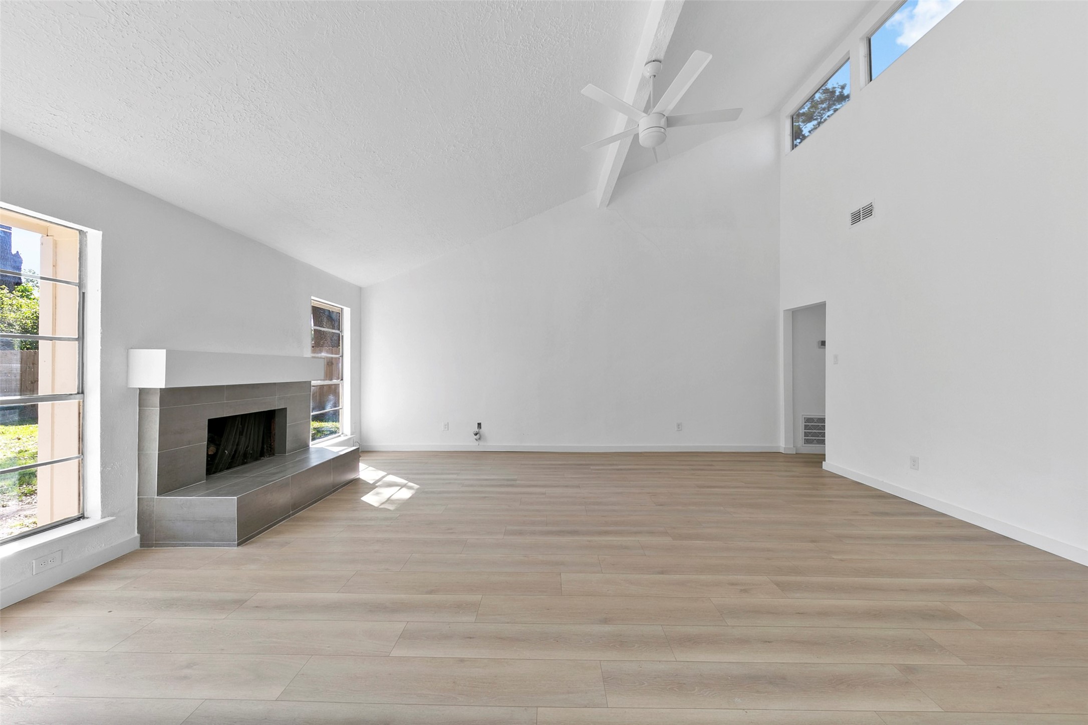 2042 Lexington Woods Drive Spring, TX 77373 - Photo 11 of 32 a view of an empty room with a fireplace and a window