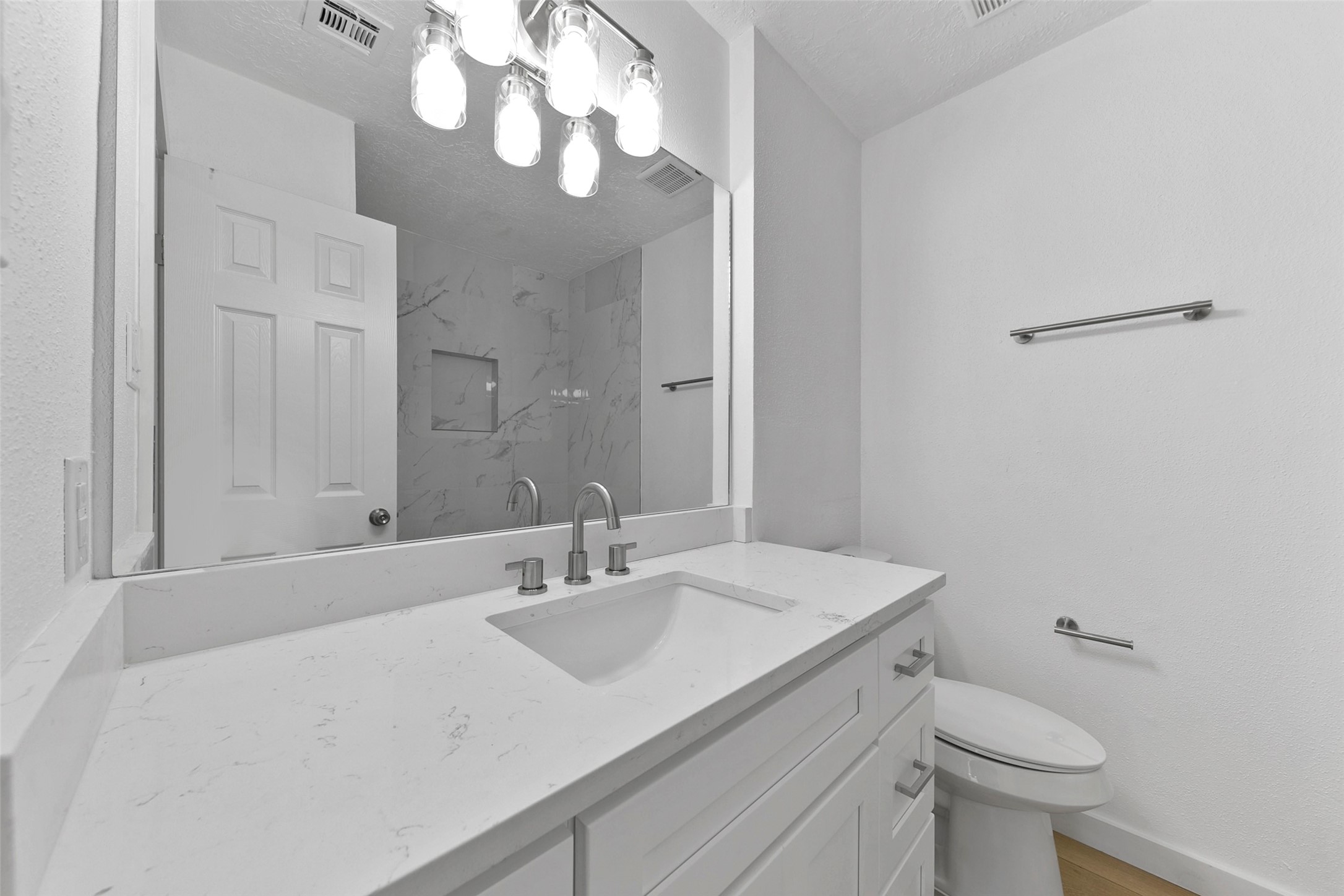 2042 Lexington Woods Drive Spring, TX 77373 - Photo 19 of 32 a bathroom with a sink a toilet and a mirror