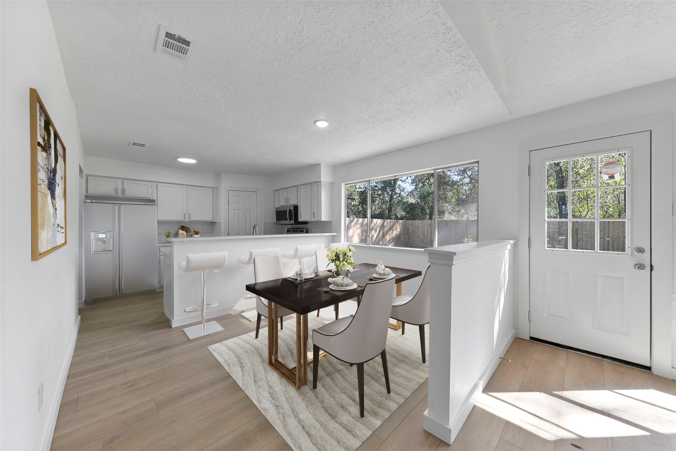 2042 Lexington Woods Drive Spring, TX 77373 - Photo 2 of 32 a view of a dining room with furniture and wooden floor