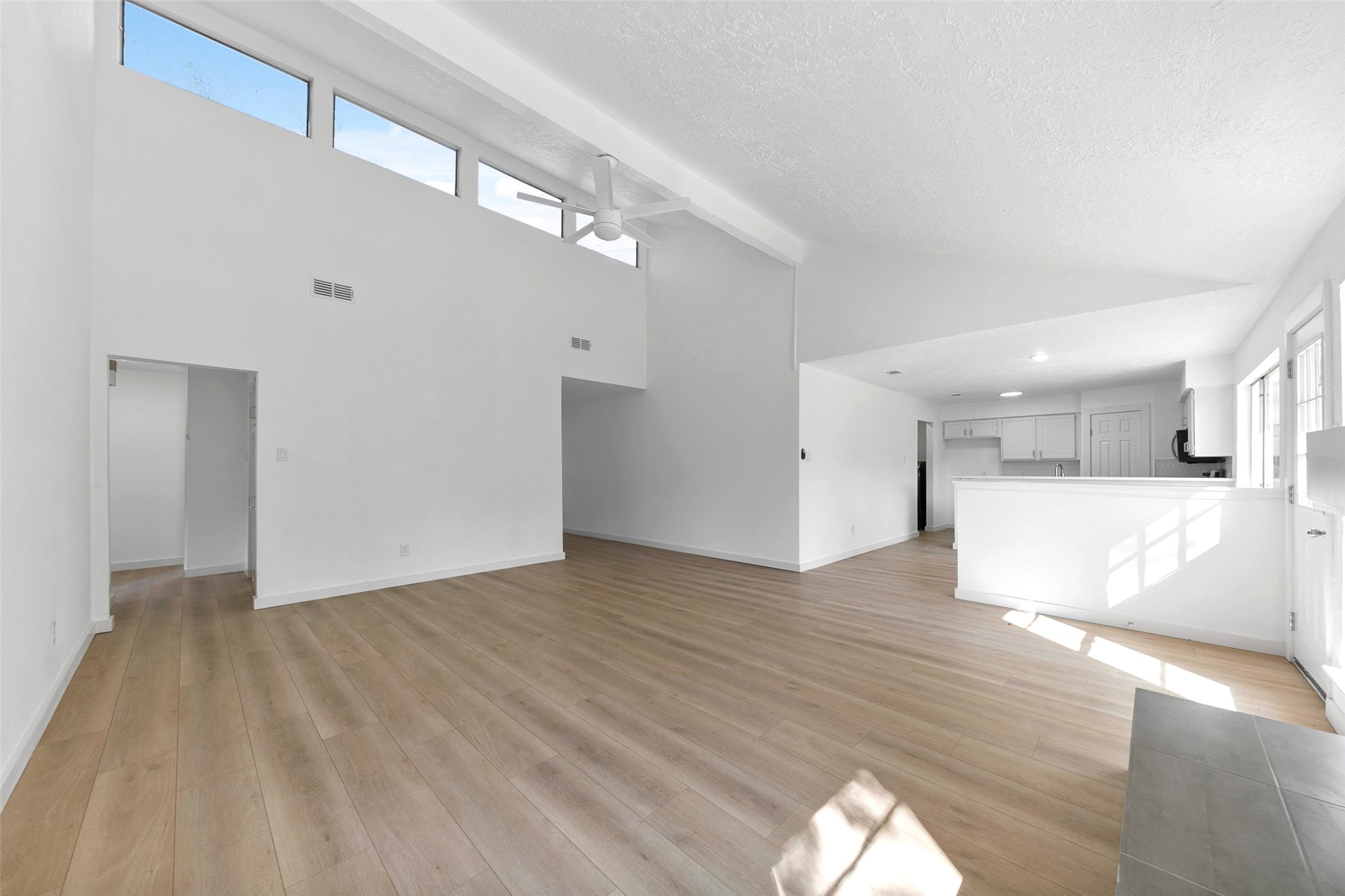 2042 Lexington Woods Drive Spring, TX 77373 - Photo 6 of 32 a view of a big room with wooden floor and windows