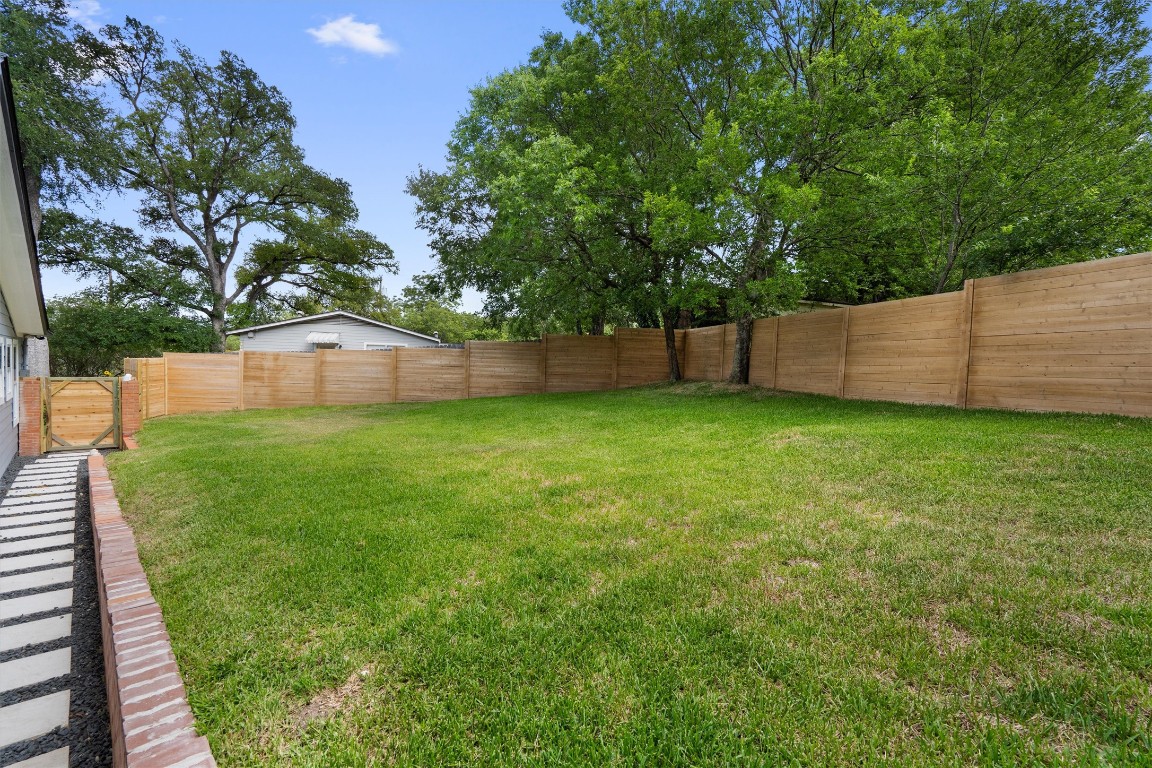 803 Glen Road Austin, TX 78753 - Photo 30 of 35 a view of a backyard with a small cabin