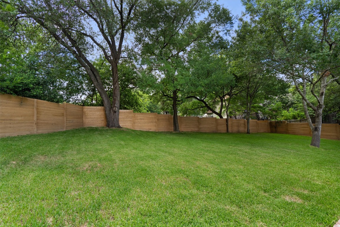 803 Glen Road Austin, TX 78753 - Photo 34 of 35 a view of a backyard with large trees