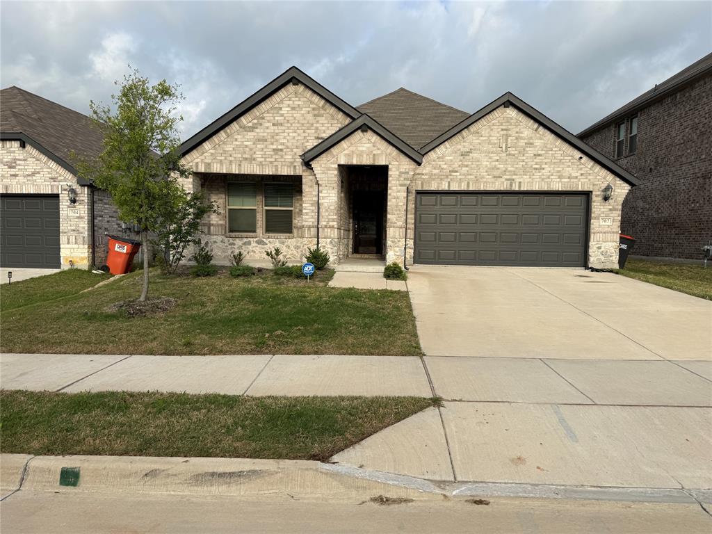 702 Williams Way Lowry Crossing, TX 75069 - Photo 1 of 22 a front view of a house with a yard and garage