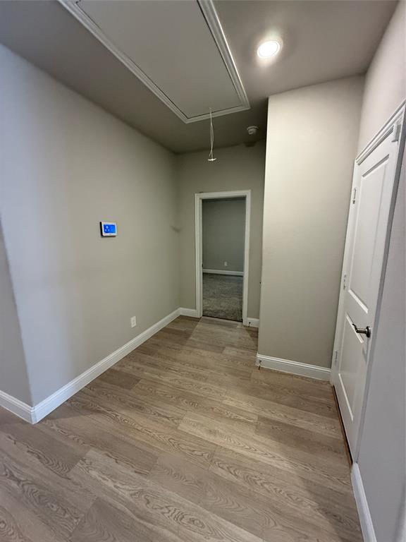 702 Williams Way Lowry Crossing, TX 75069 - Photo 14 of 22 an empty room with wooden floor and entrance