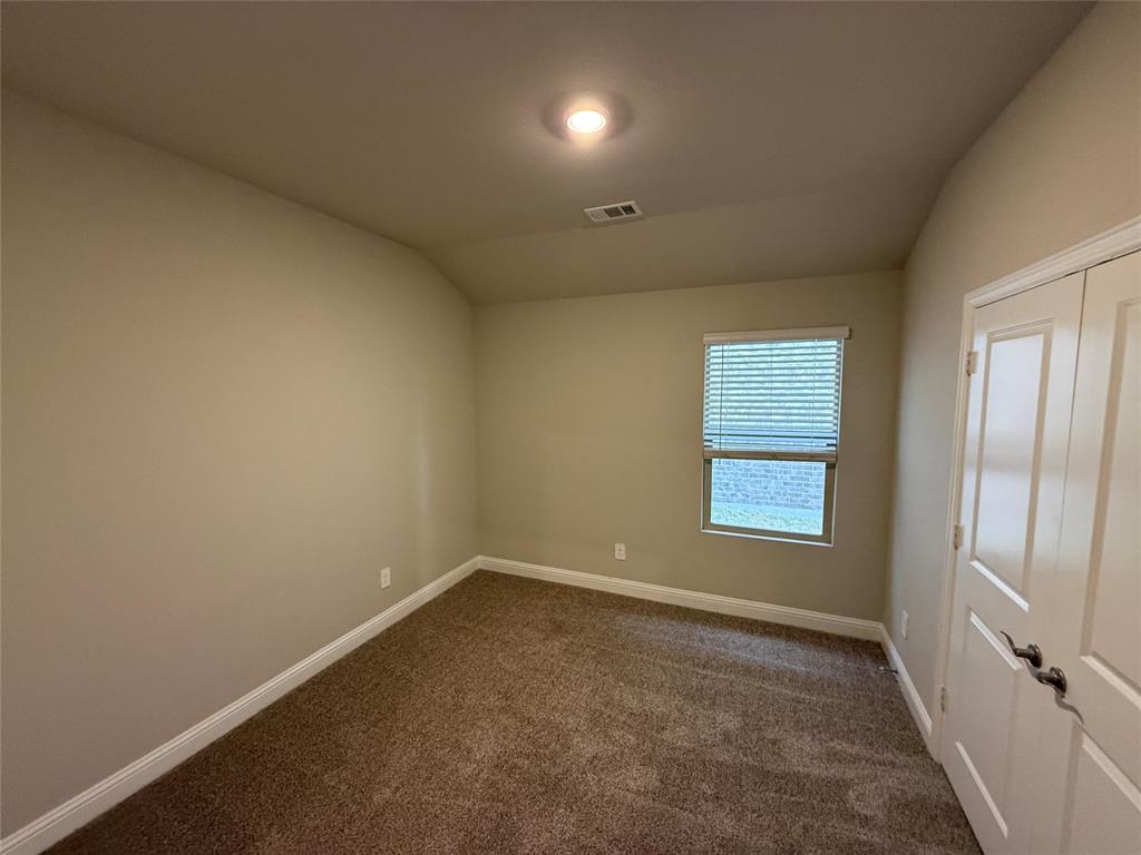 702 Williams Way Lowry Crossing, TX 75069 - Photo 15 of 22 an empty room with a window