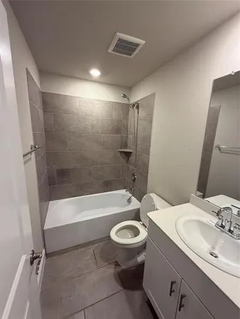 a bathroom with a sink a toilet and a bathtub