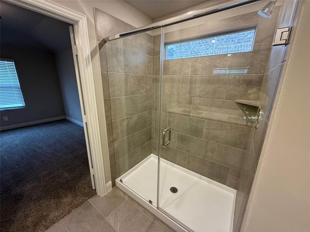702 Williams Way Lowry Crossing, TX 75069 - Photo 20 of 22 a bathroom with a glass door shower and a sink