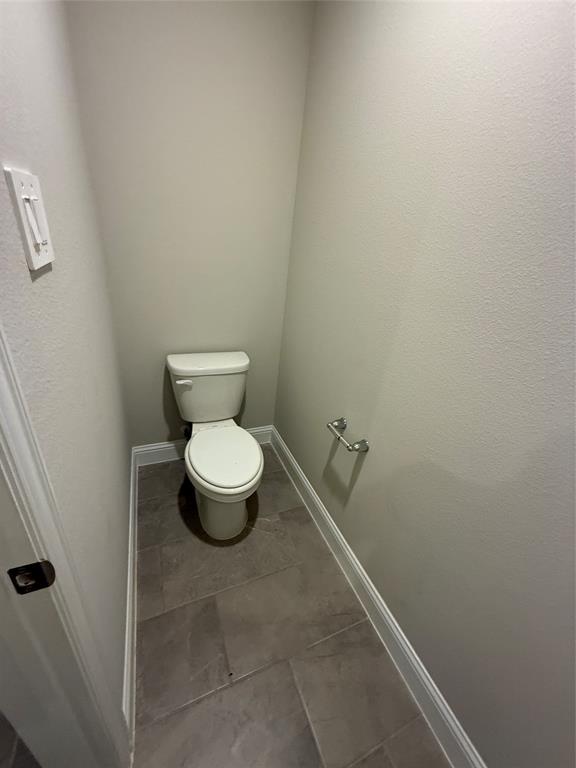 702 Williams Way Lowry Crossing, TX 75069 - Photo 21 of 22 a bathroom with a toilet
