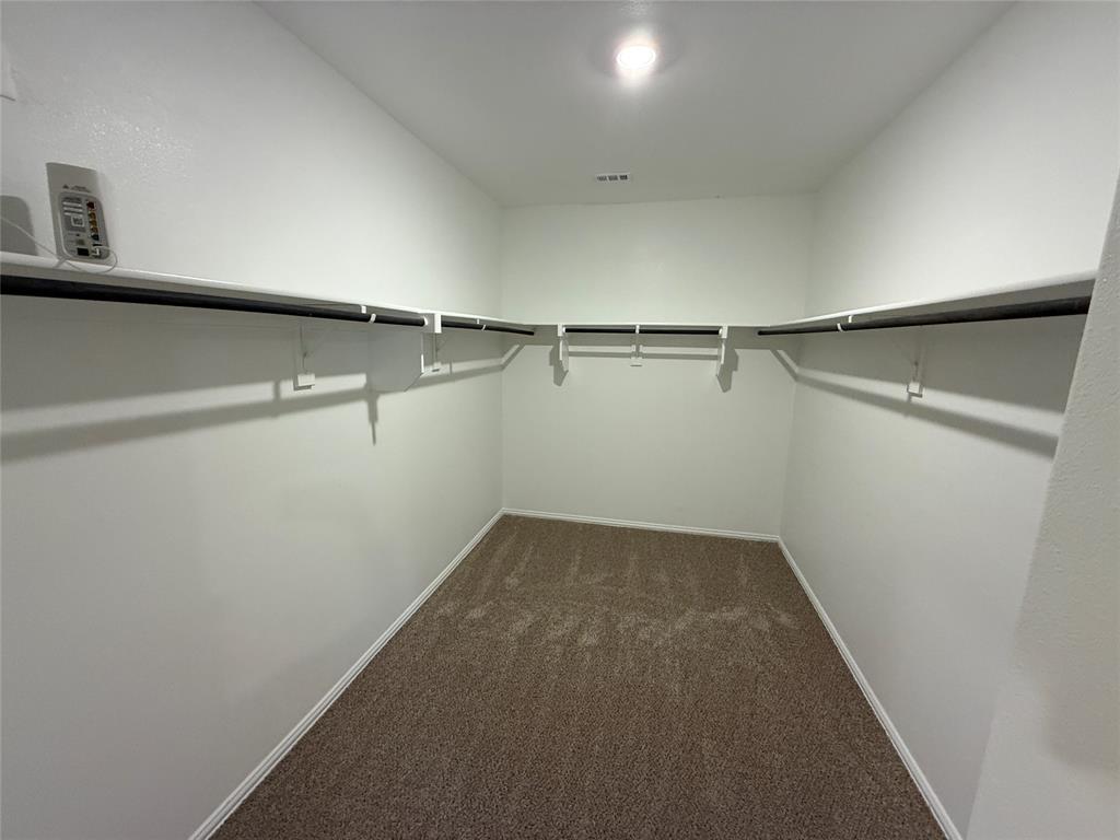 702 Williams Way Lowry Crossing, TX 75069 - Photo 22 of 22 a view of small space with racks on the wall