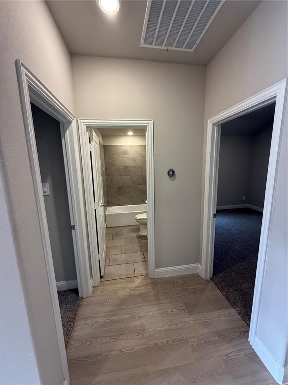 702 Williams Way Lowry Crossing, TX 75069 - Photo 8 of 22 an empty room with wooden floor and entrance