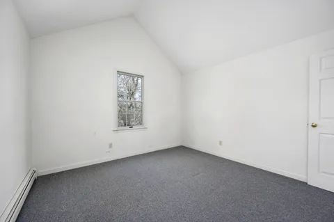 a view of an empty room with a garage