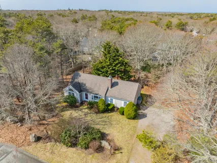 an aerial view of a house with a swimming pool