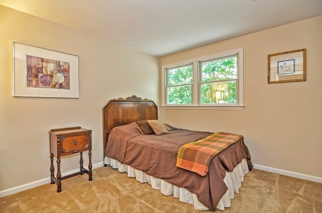 948 Salem End Road Framingham, MA 01702 - Photo 16 of 23 a bedroom with a bed and a painting on the wall