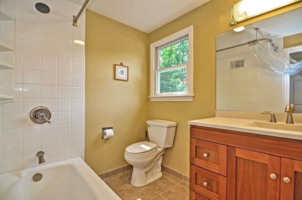 948 Salem End Road Framingham, MA 01702 - Photo 19 of 23 a bathroom with a sink a toilet and shower