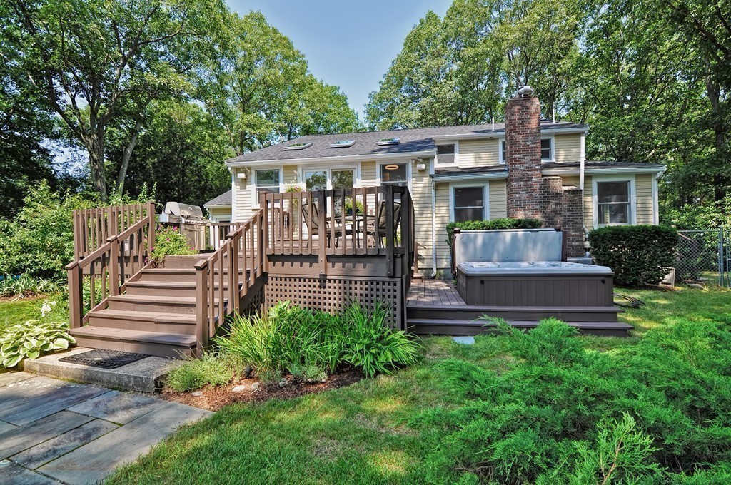 948 Salem End Road Framingham, MA 01702 - Photo 22 of 23 a front view of house with a garden