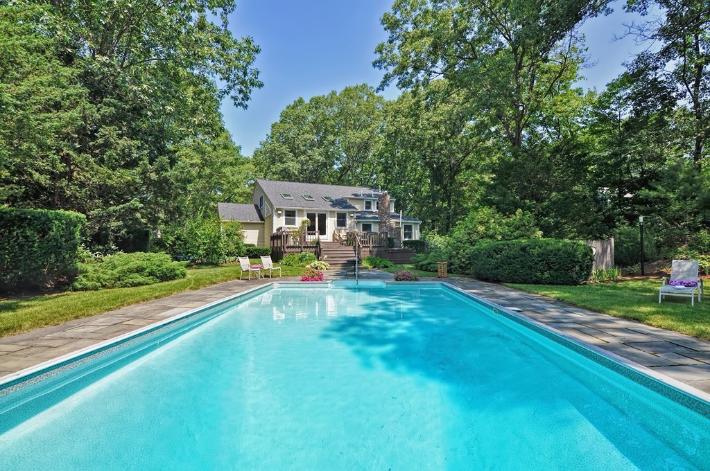 948 Salem End Road Framingham, MA 01702 - Photo 3 of 23 a view of swimming pool with lawn chairs and a big yard