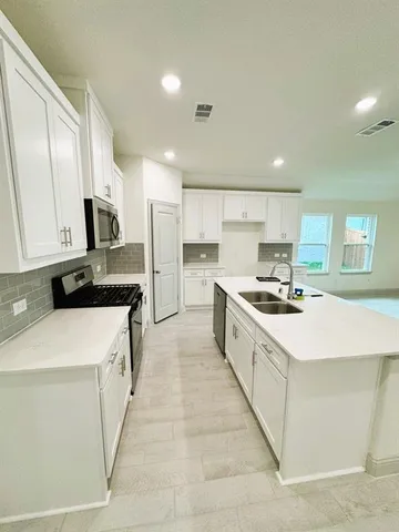 a view of a kitchen with a sink