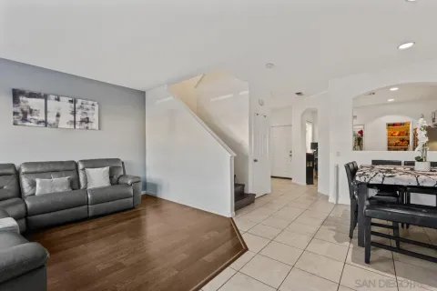 a view of a hallway to a livingroom and a hallway with couch